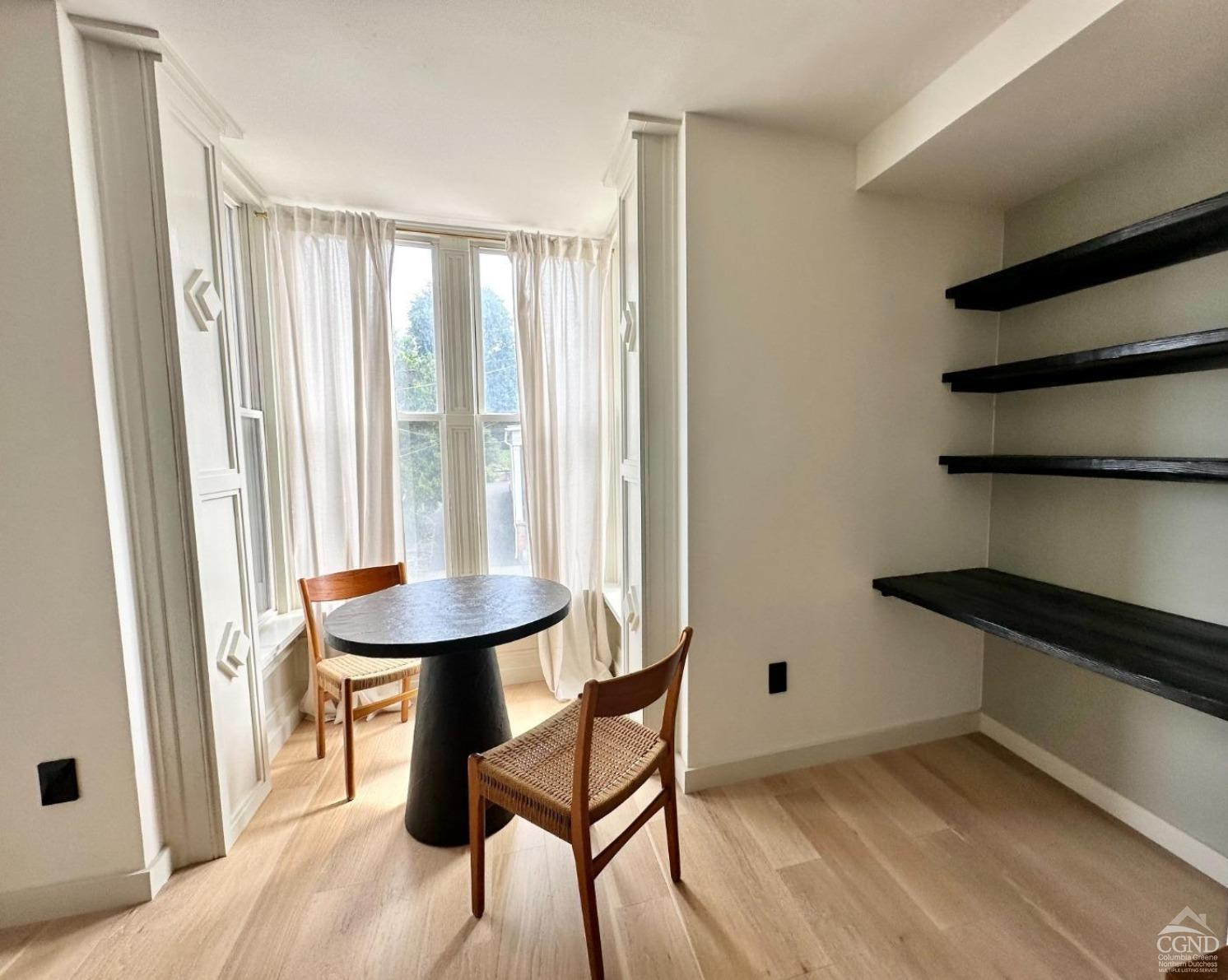 261 Main Street, Unit 6 Catskill, NY 12414 - Photo 5 of 10 a view of a room with a table and chairs