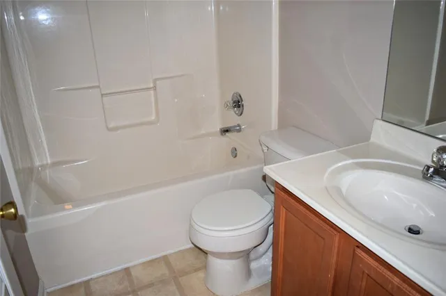 a bathroom with a sink a toilet and a bathtub