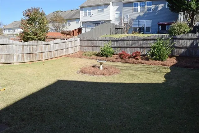 a view of a swimming pool with a yard