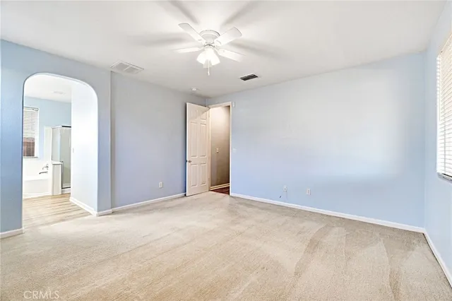 a bathroom with a granite countertop sink and a large mirror