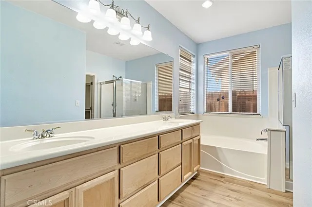 a bathroom with a bathtub and a shower