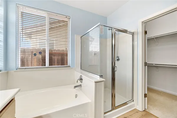 a close view of a closet and a wooden floor