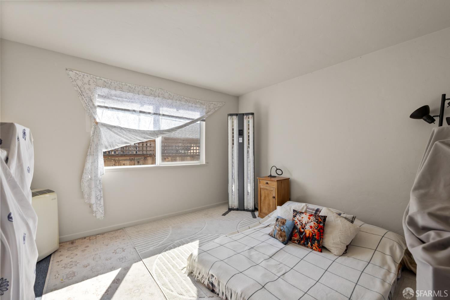 481 Rollins Road Burlingame, CA 94010 - Photo 13 of 16 a bedroom with a bed and wooden floor