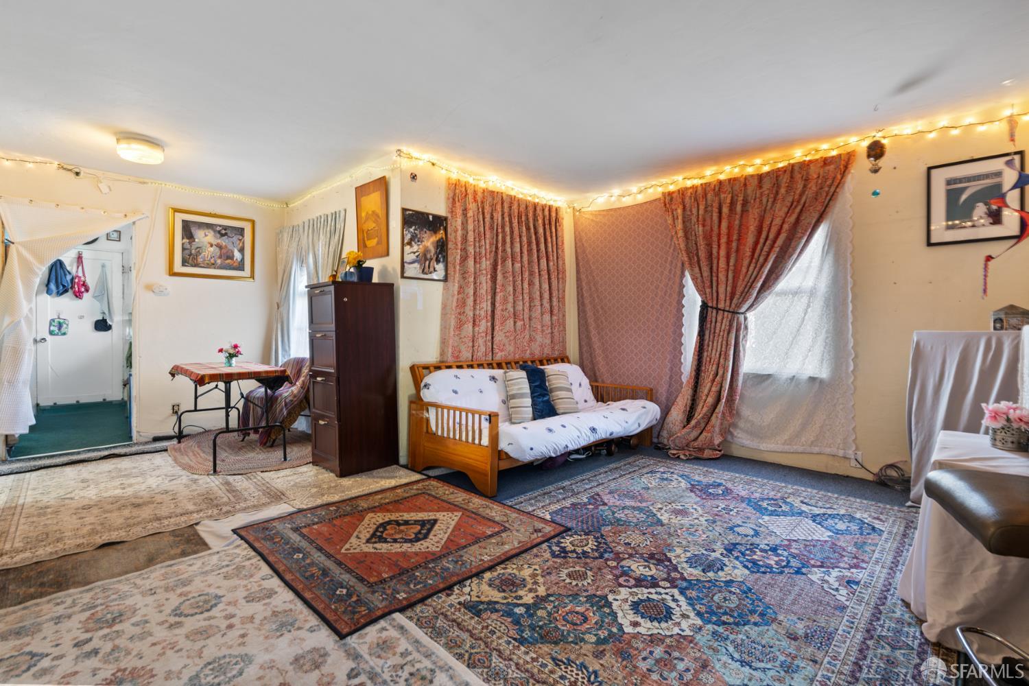 481 Rollins Road Burlingame, CA 94010 - Photo 3 of 16 a living room with furniture and a rug