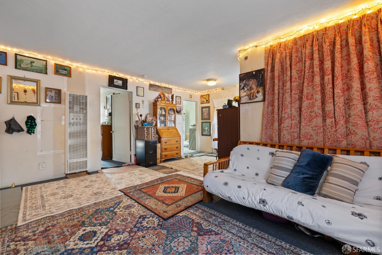 481 Rollins Road Burlingame, CA 94010 - Photo 4 of 16 a living room with furniture and a rug