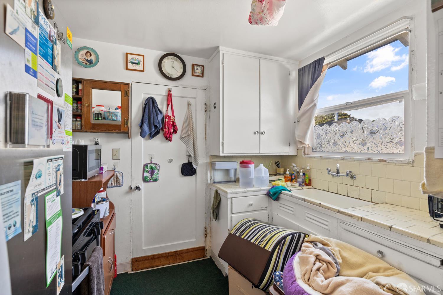 481 Rollins Road Burlingame, CA 94010 - Photo 6 of 16 a room with furniture and painting on the wall