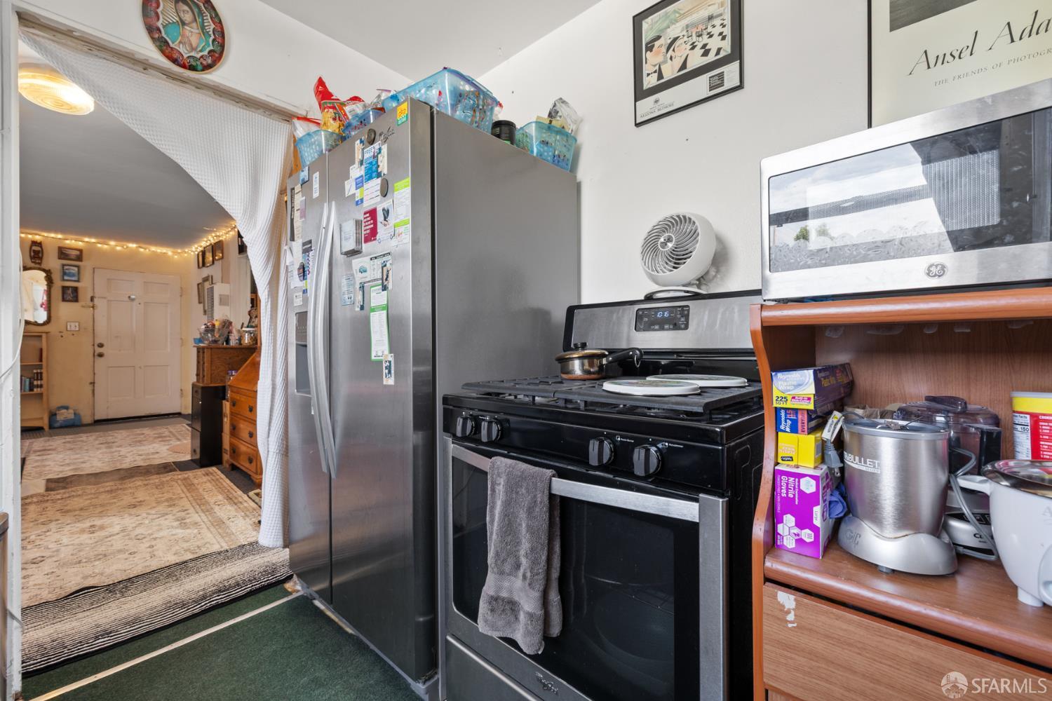 481 Rollins Road Burlingame, CA 94010 - Photo 8 of 16 a kitchen with a stove and a refrigerator