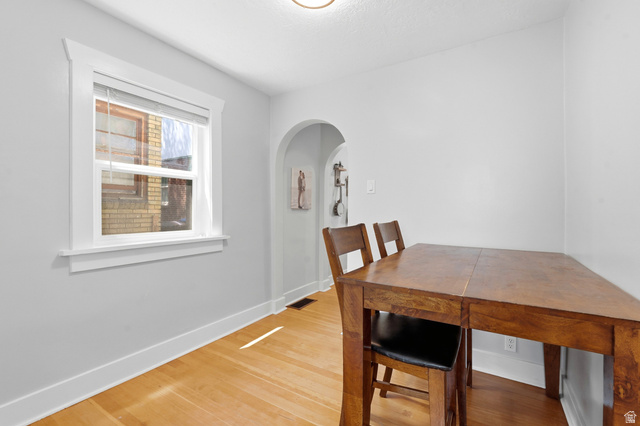 210 North 200 West Logan, UT 84321 - Photo 13 of 31 Light-filled room featuring wood-finish flooring and a white trimmed window