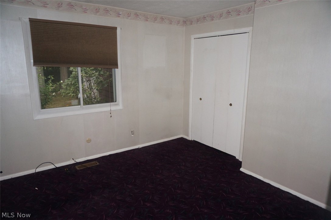 1087 Broadmoor Road Macedonia, OH 44056 - Photo 13 of 35 Bedroom is 11x13 with a lovely backyard view and double door closet for ease of access.