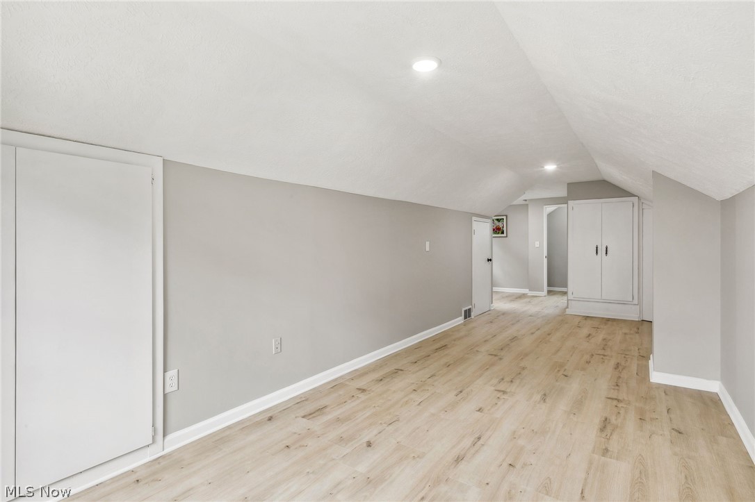 1407 Sunview Road Lyndhurst, OH 44124 - Photo 23 of 33 Bonus room with lofted ceiling and light hardwood / wood-style flooring