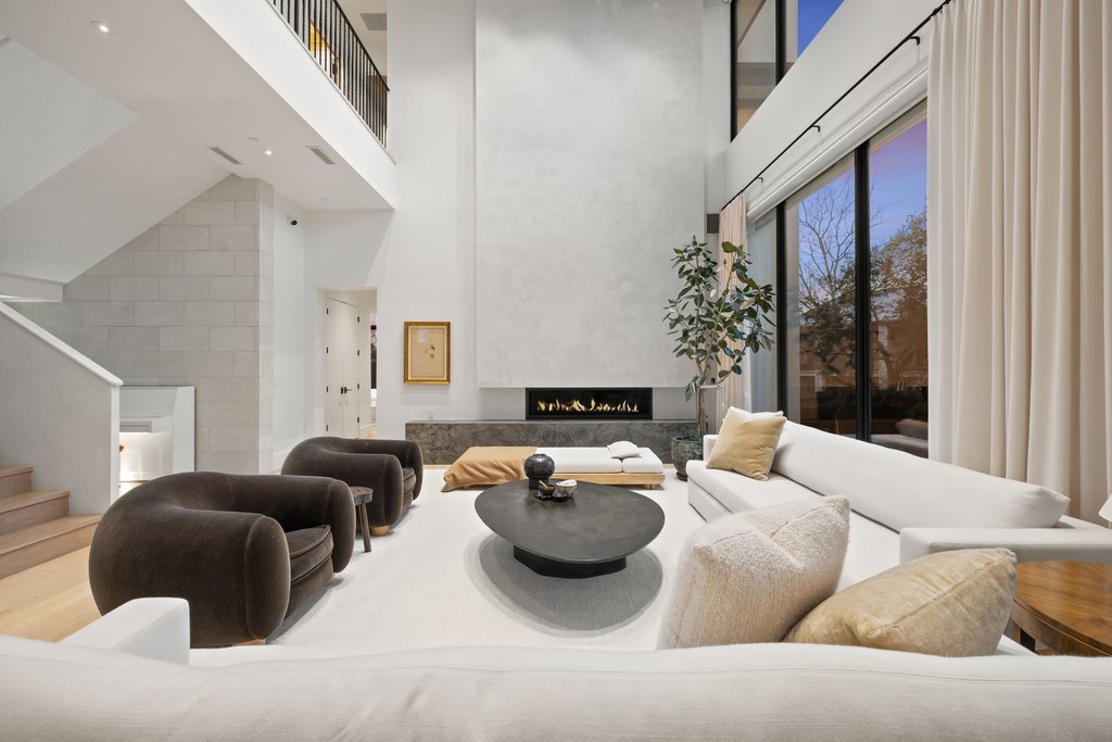 5 Inwood Cove Austin, TX 78746 - Photo 1 of 39 Living area featuring a premium fireplace and a high ceiling