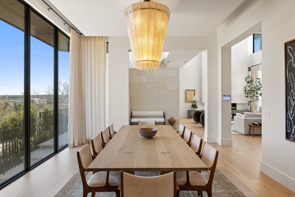 5 Inwood Cove Austin, TX 78746 - Photo 11 of 39 Dining room with light wood-style flooring and expansive windows