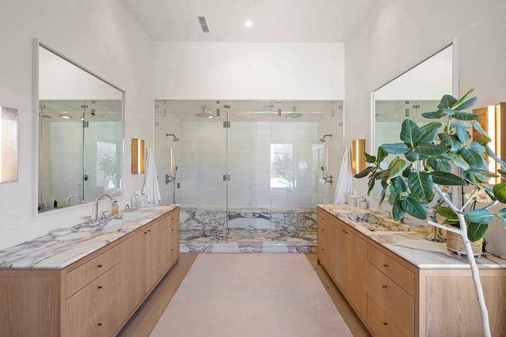 5 Inwood Cove Austin, TX 78746 - Photo 26 of 39 Bathroom featuring two vanities and a marble finish shower