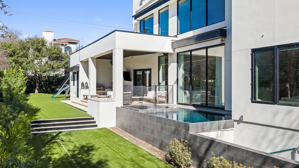 5 Inwood Cove Austin, TX 78746 - Photo 3 of 39 Rear view of property with a playground, a patio, and stucco siding