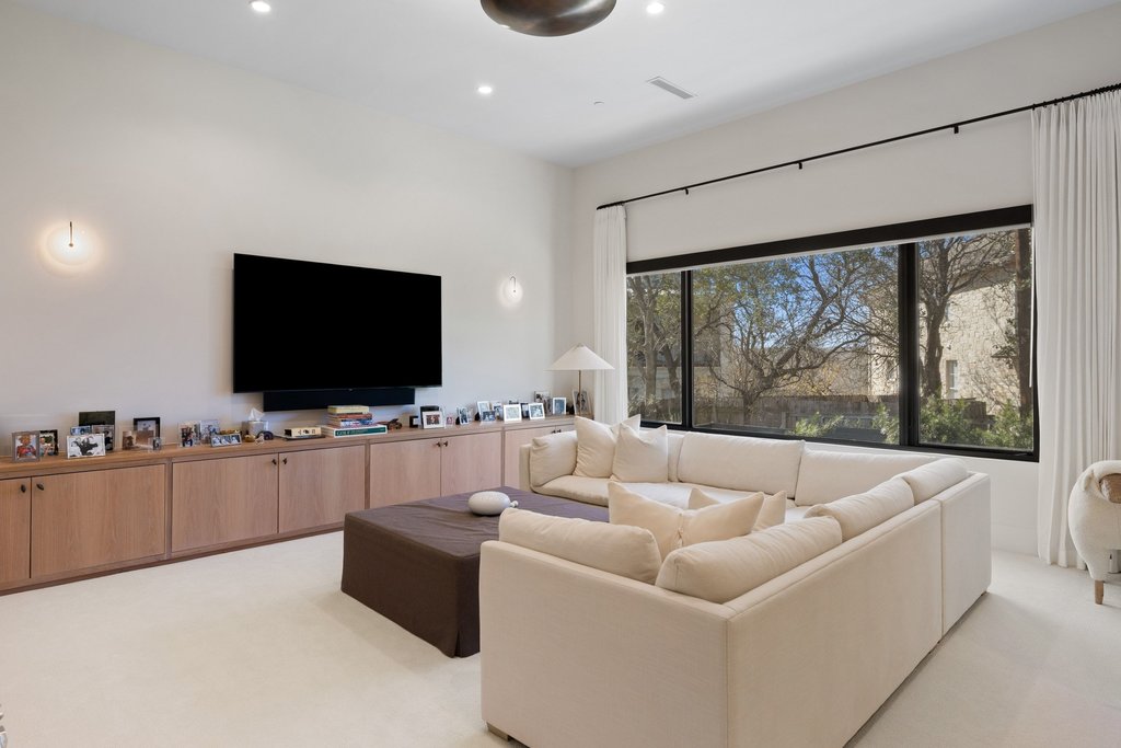 5 Inwood Cove Austin, TX 78746 - Photo 30 of 39 Living area with light carpet and recessed lighting