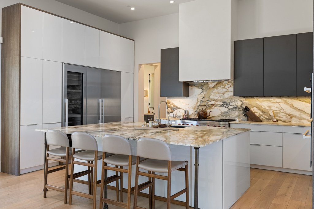 5 Inwood Cove Austin, TX 78746 - Photo 7 of 39 Kitchen with modern cabinets, built in fridge, light wood-type flooring, white cabinets, and a high ceiling