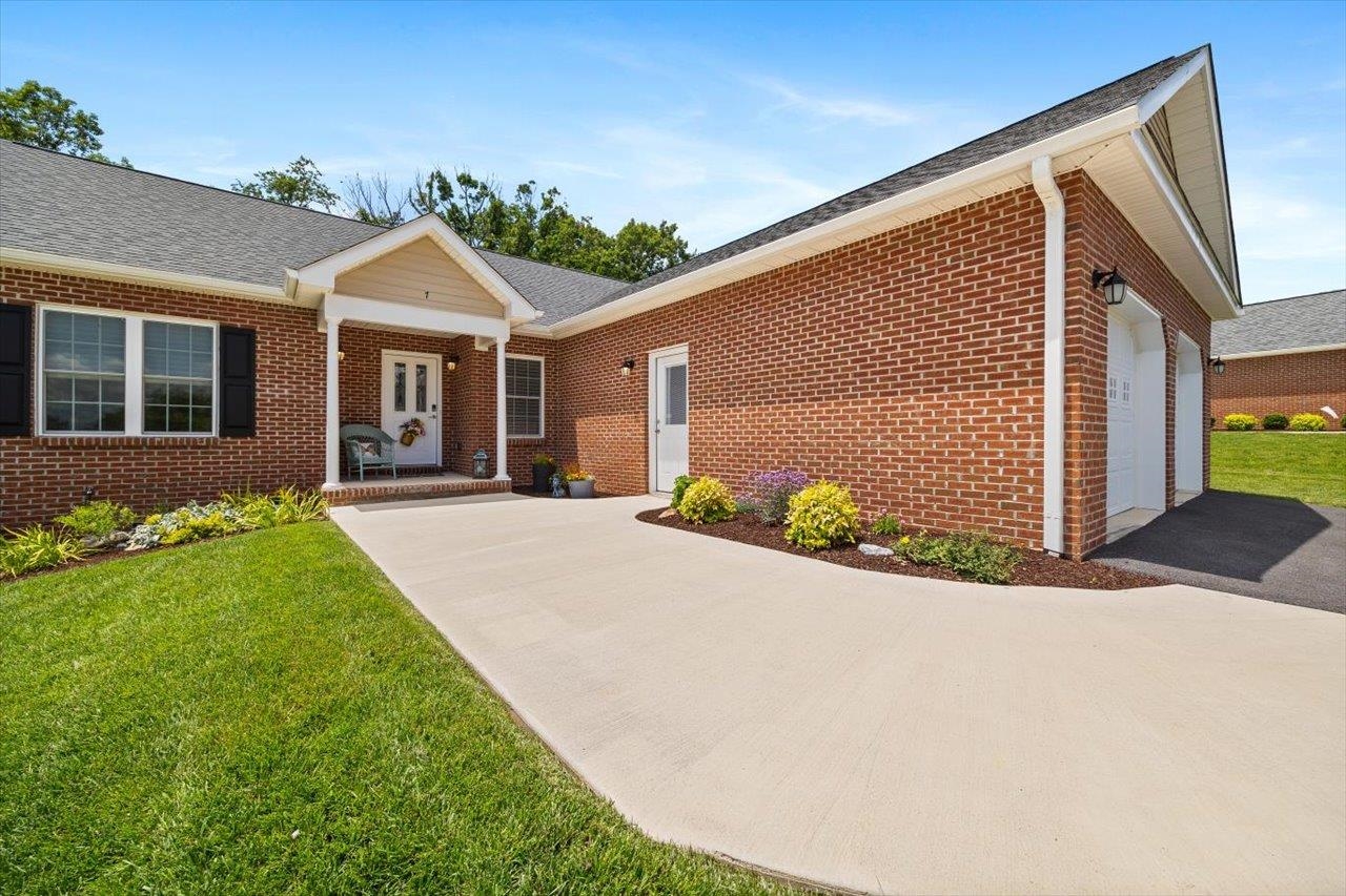 7 Oak View Drive Staunton, VA 24401 - Photo 42 of 53 a front view of a house with a garden and yard