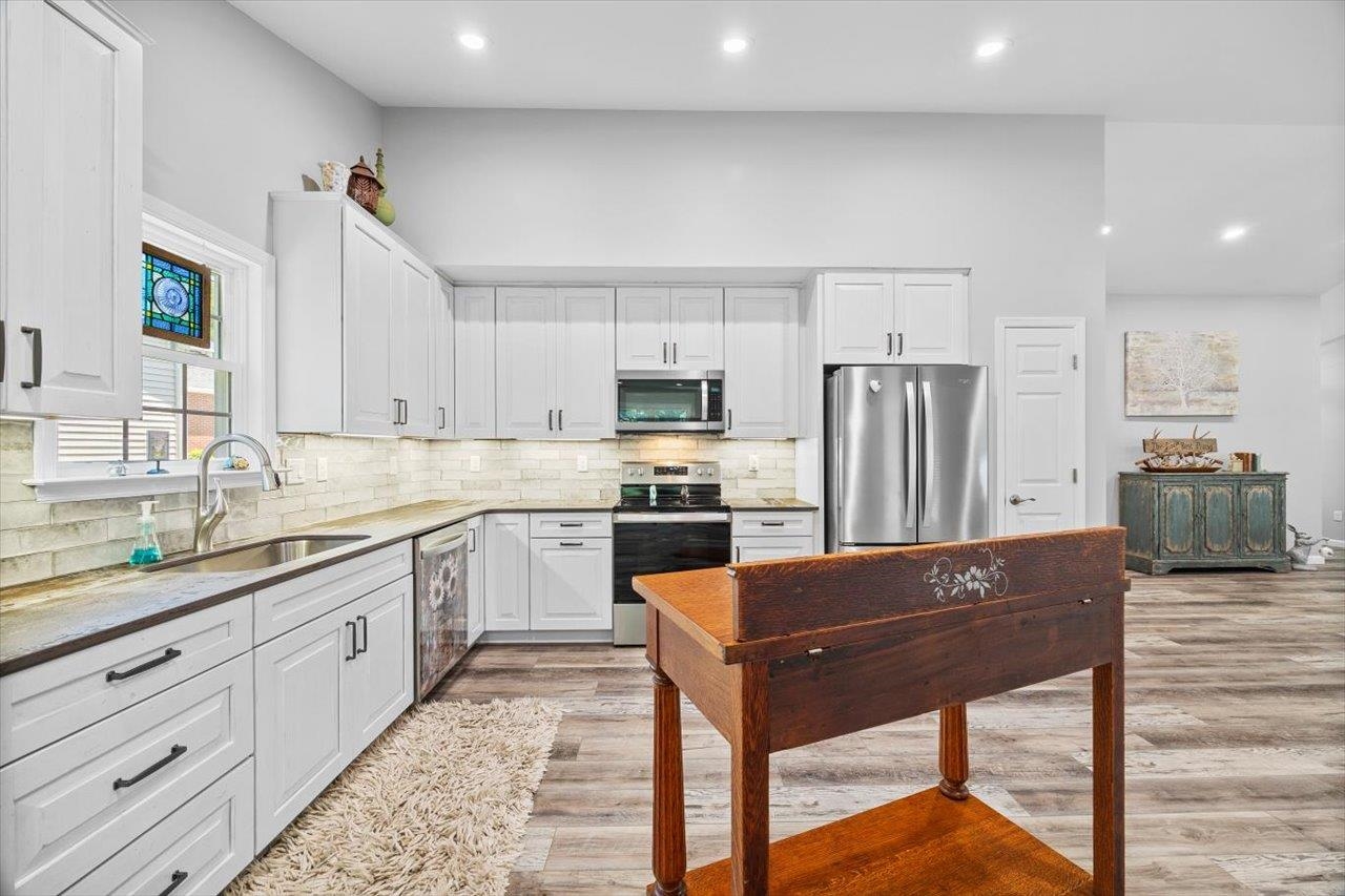 7 Oak View Drive Staunton, VA 24401 - Photo 8 of 53 a kitchen with stainless steel appliances kitchen island granite countertop a refrigerator and a stove top oven