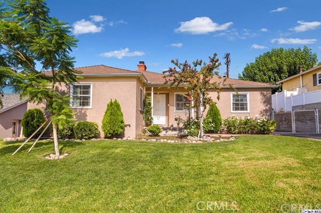 943 Birmingham Road Burbank, CA 91504 - Photo 1 of 1 a front view of house with yard and green space