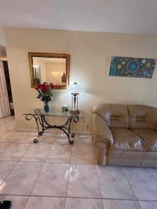 5681 Southwest 2nd Court, Unit 204 Margate, FL 33068 - Photo 12 of 22 a living room with couches and a coffee table