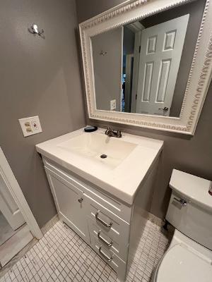 5681 Southwest 2nd Court, Unit 204 Margate, FL 33068 - Photo 18 of 22 a bathroom with a sink and a mirror