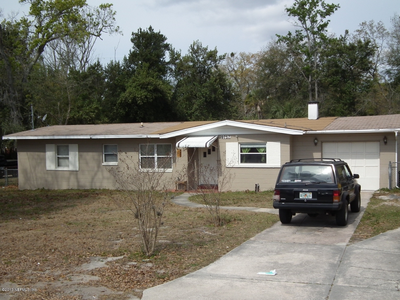 9757 Patton Road Jacksonville, FL 32246 - Photo 2 of 6 a car parked in front of a house