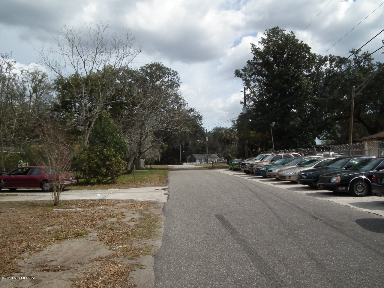 9757 Patton Road Jacksonville, FL 32246 - Photo 4 of 6 a view of car parked on the side of the road