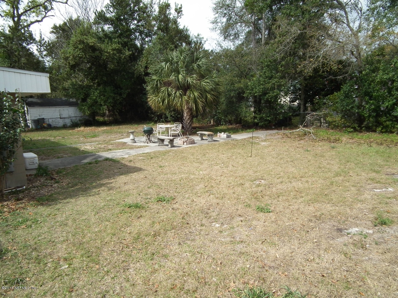 9757 Patton Road Jacksonville, FL 32246 - Photo 6 of 6 a view of swimming pool with a yard