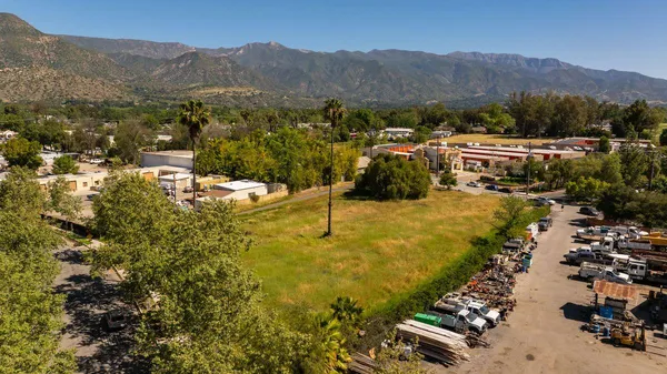 a view of a town with mountains in the background
