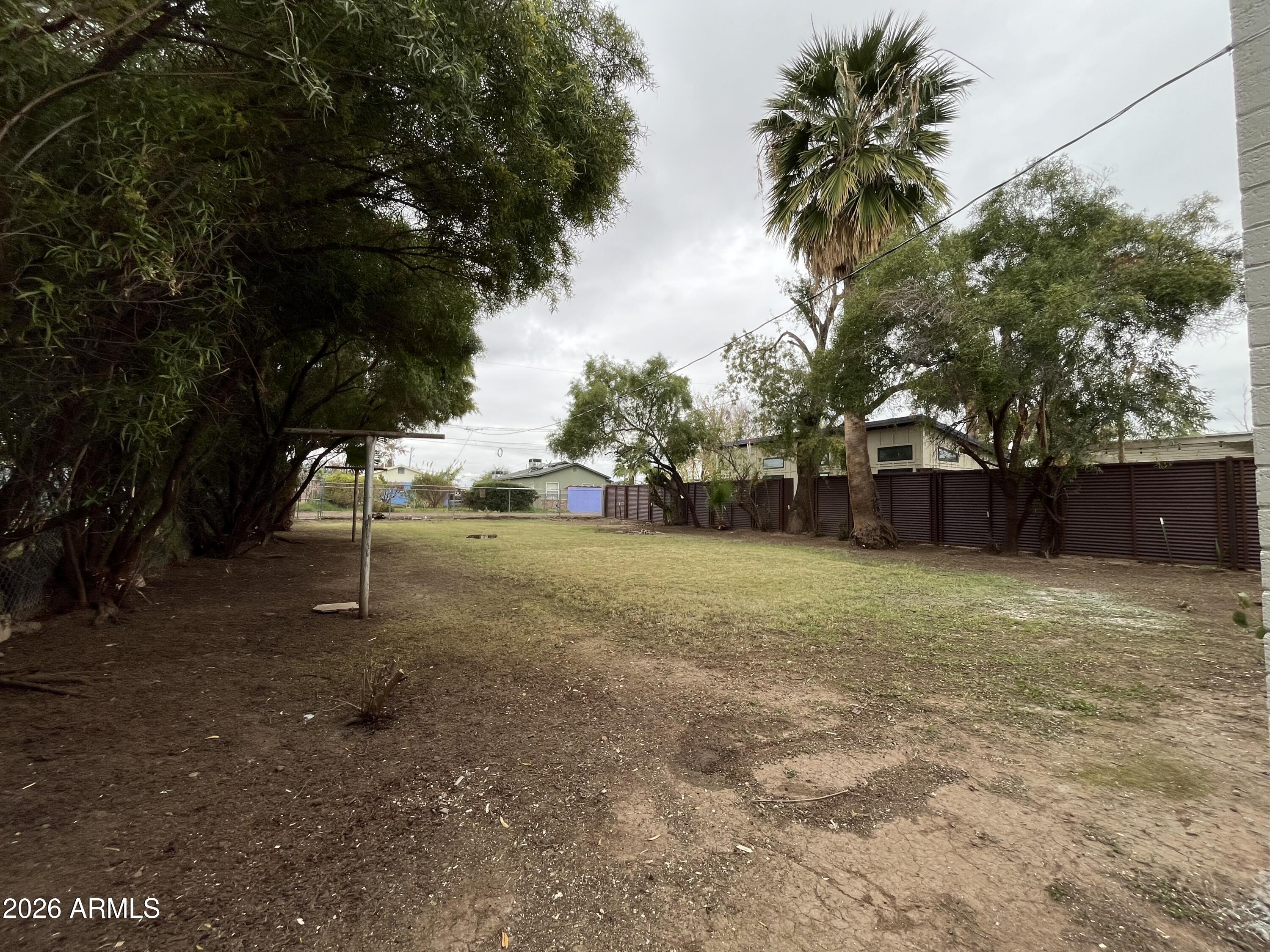 1226 South Roosevelt Street Tempe, AZ 85281 - Photo 16 of 26 a backyard of a house with lots of green space