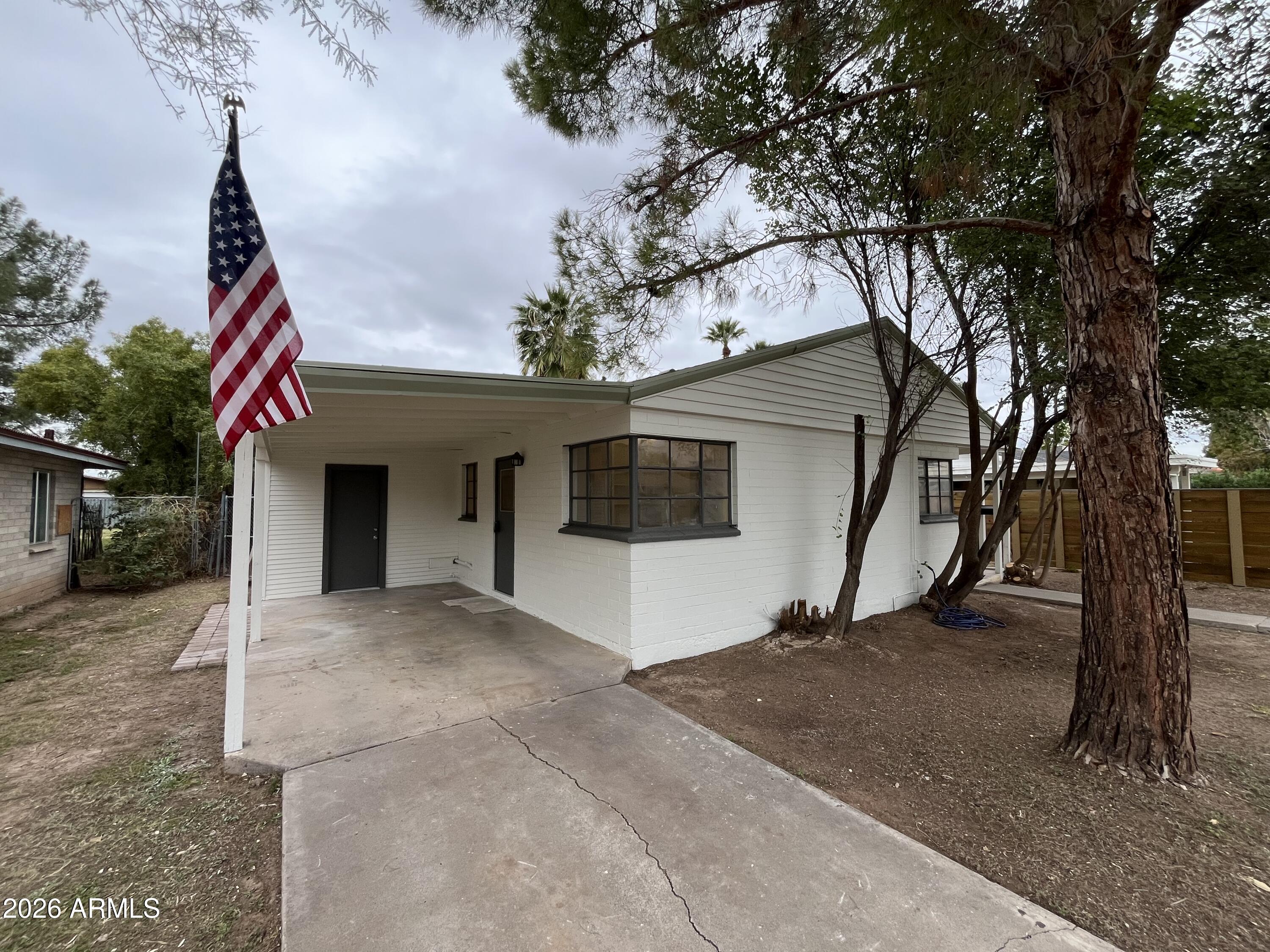1226 South Roosevelt Street Tempe, AZ 85281 - Photo 3 of 26 a house with trees in front of it