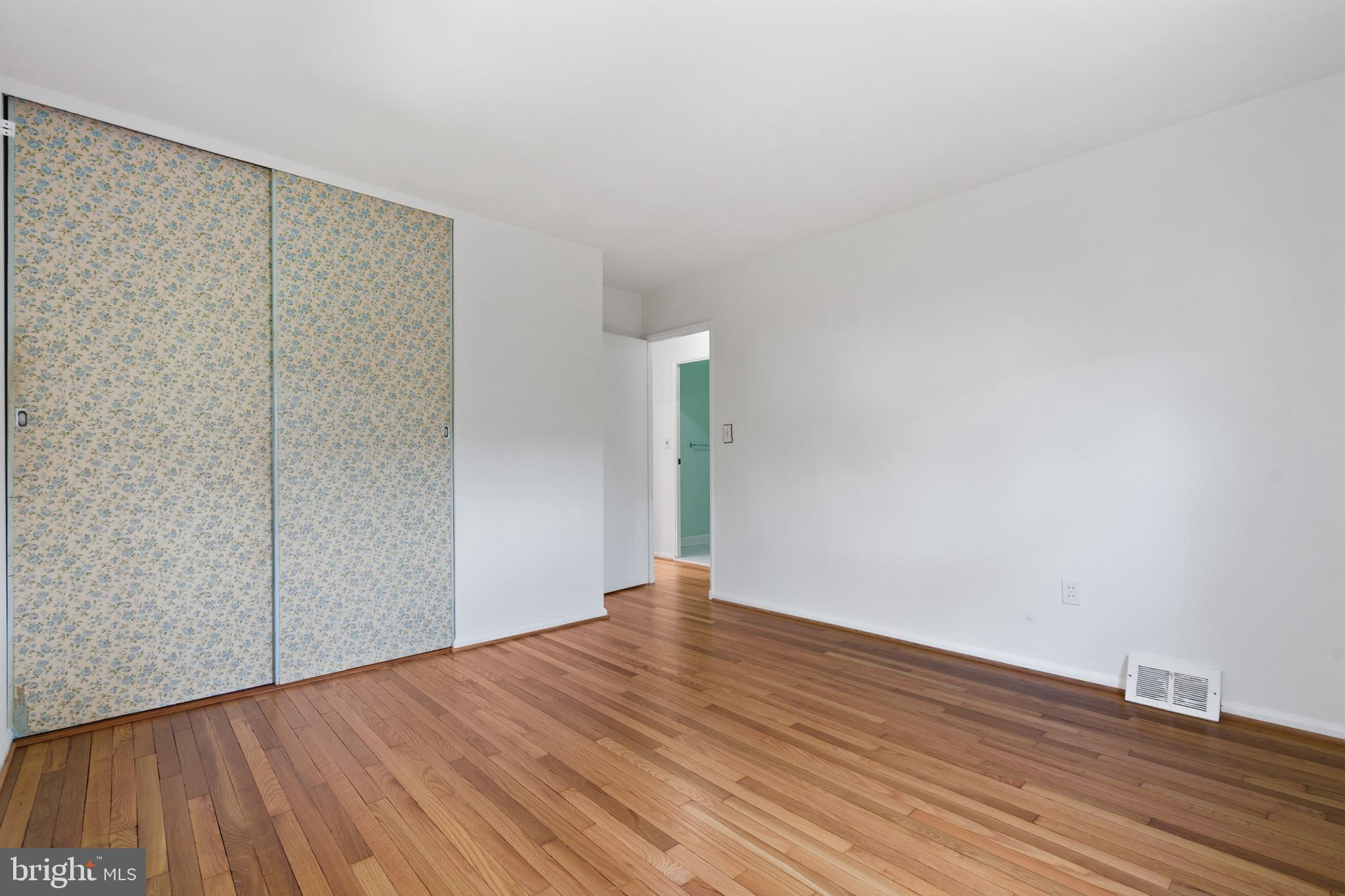 10204 Rodgers Road Fairfax, VA 22030 - Photo 12 of 29 a view of an empty room with wooden floor