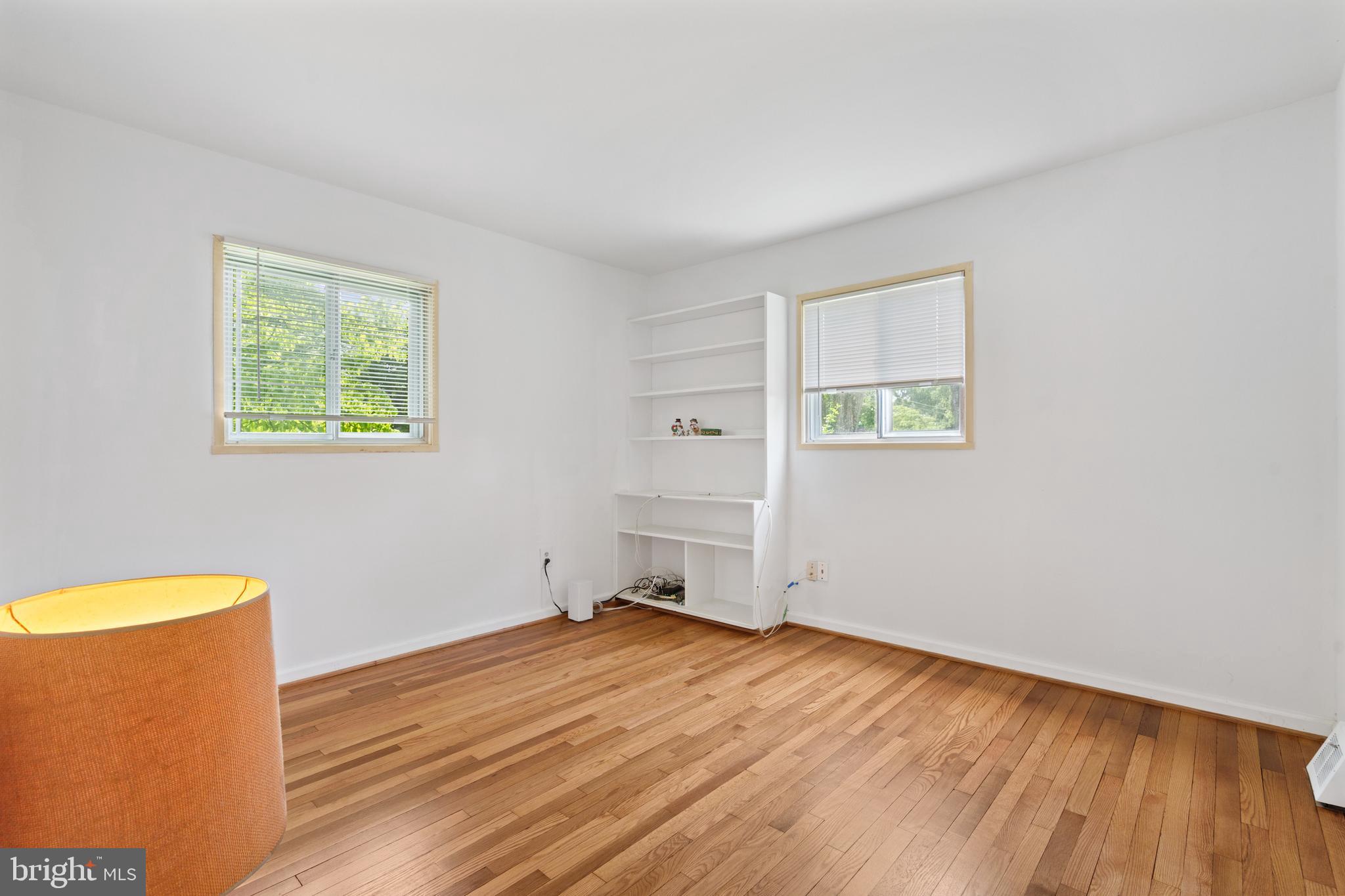 10204 Rodgers Road Fairfax, VA 22030 - Photo 13 of 29 a view of empty room with wooden floor and fan