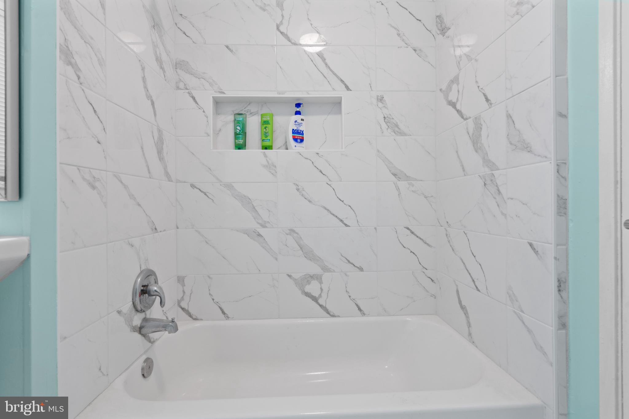 10204 Rodgers Road Fairfax, VA 22030 - Photo 16 of 29 a bathroom with a bathtub