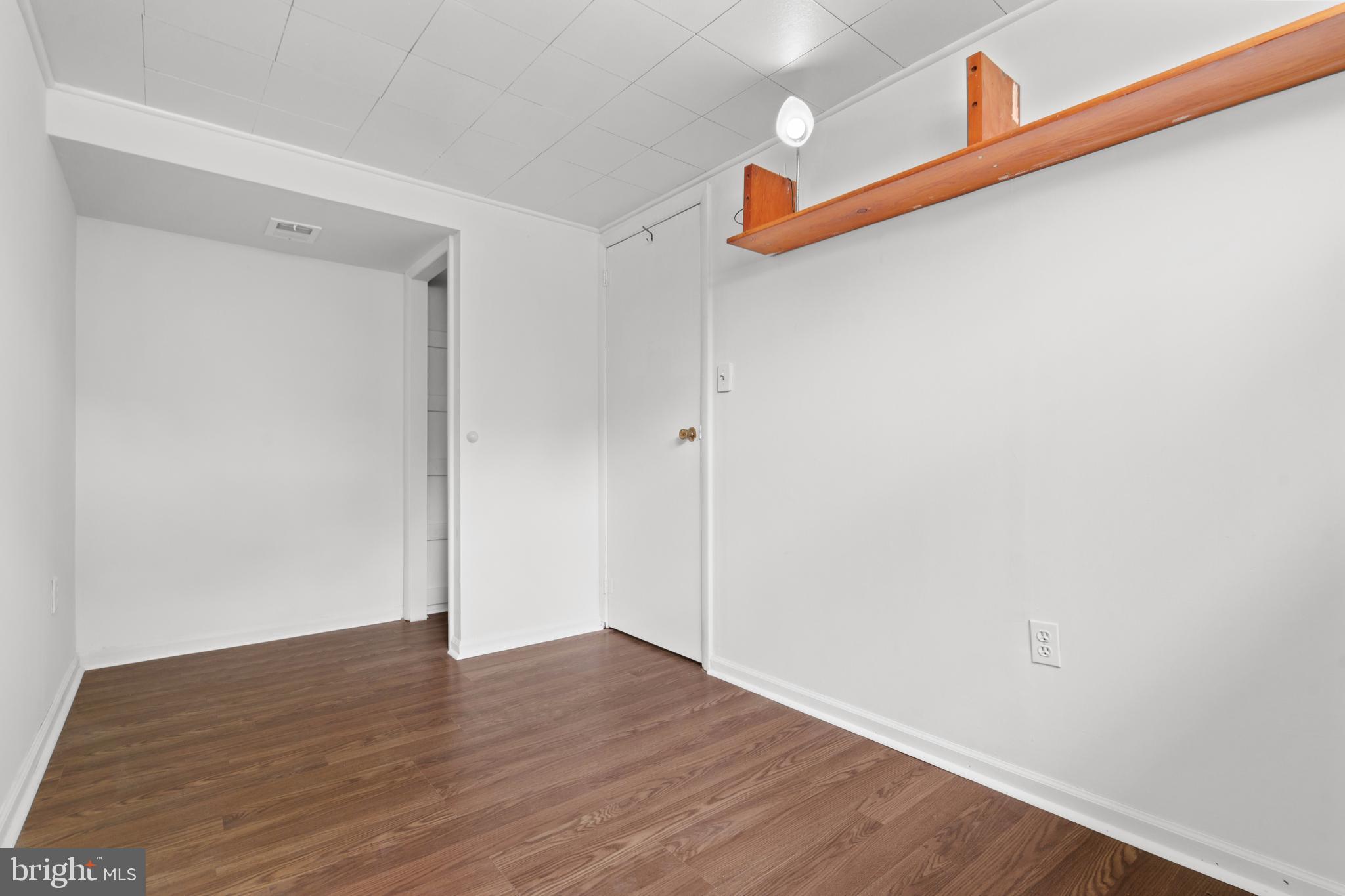 10204 Rodgers Road Fairfax, VA 22030 - Photo 20 of 29 a view of a room with wooden floor