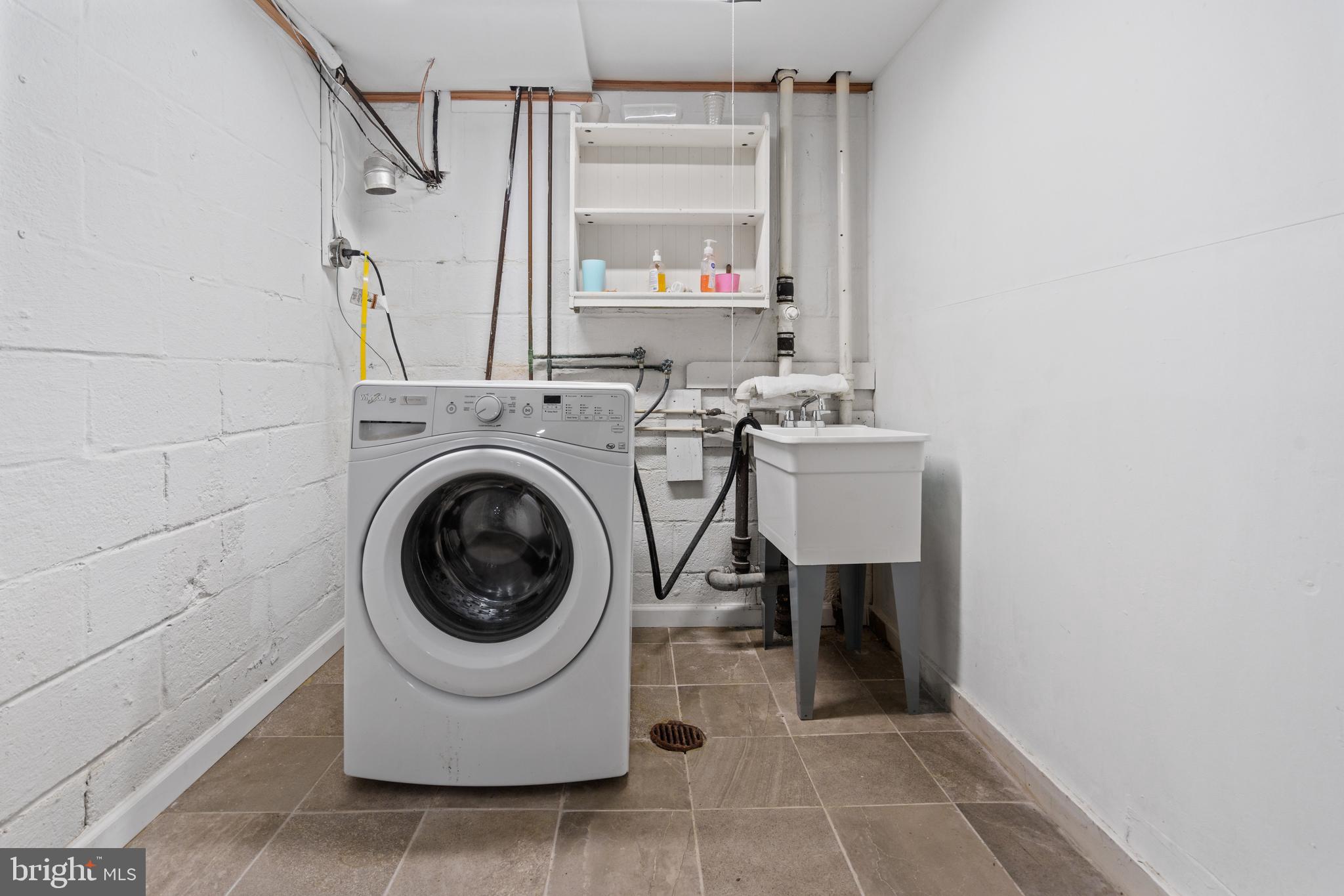 10204 Rodgers Road Fairfax, VA 22030 - Photo 23 of 29 a utility room with sink dryer and washer