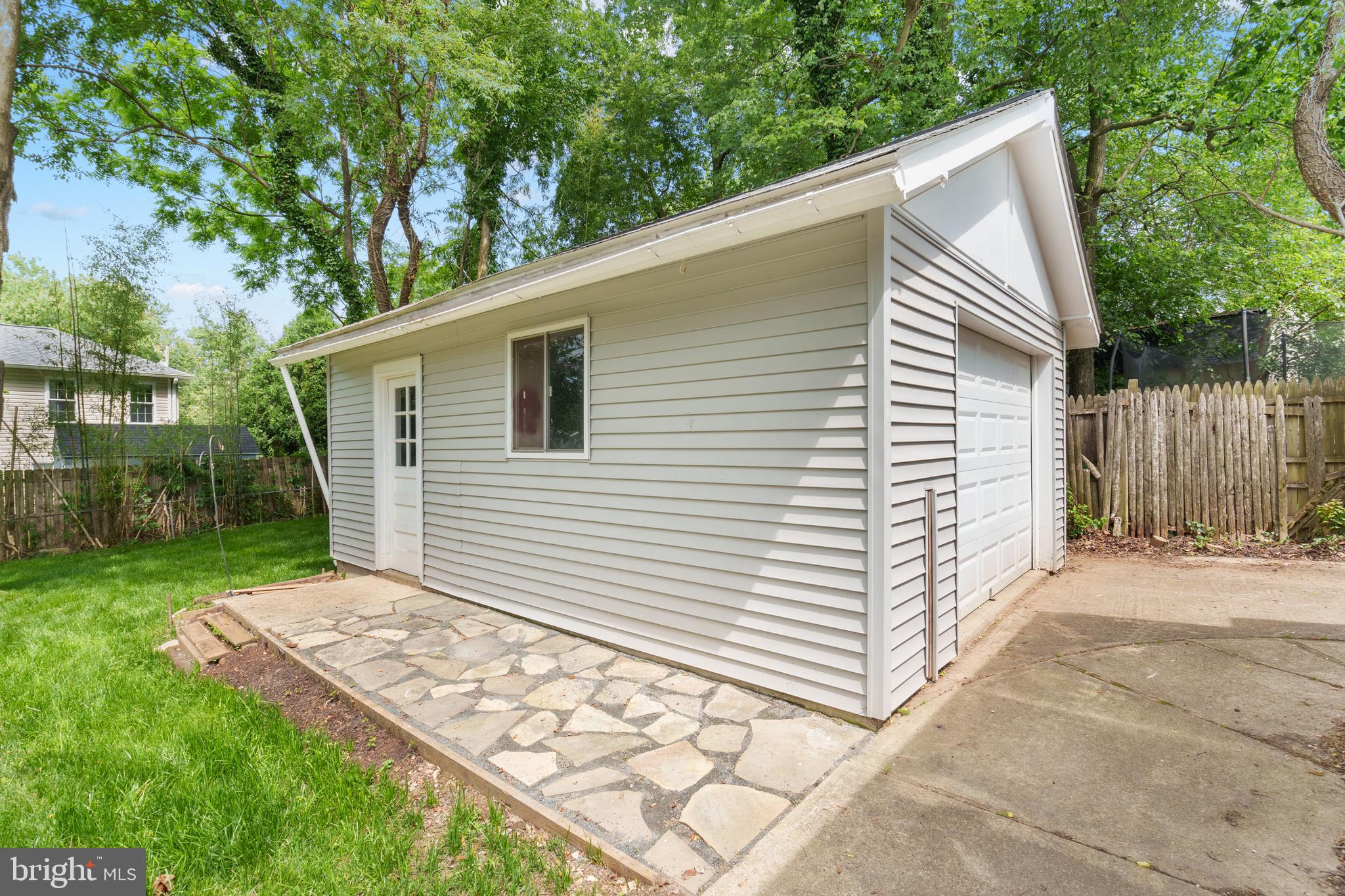 10204 Rodgers Road Fairfax, VA 22030 - Photo 26 of 29 a view of a backyard with a large tree
