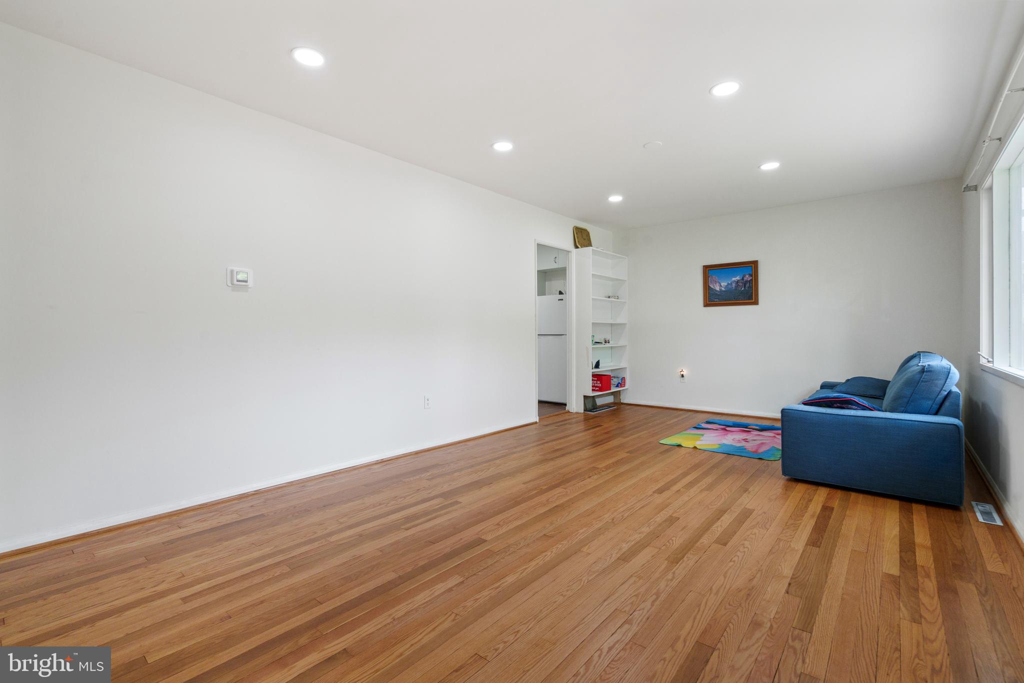 10204 Rodgers Road Fairfax, VA 22030 - Photo 6 of 29 a view of empty room with wooden floor