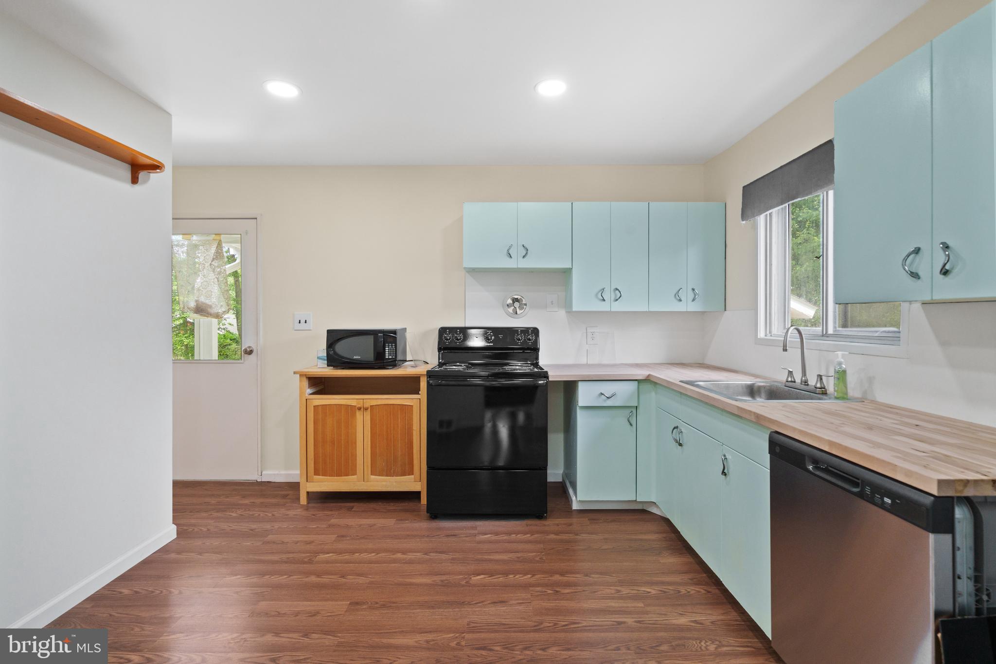 10204 Rodgers Road Fairfax, VA 22030 - Photo 8 of 29 a kitchen with a sink and a stove top oven