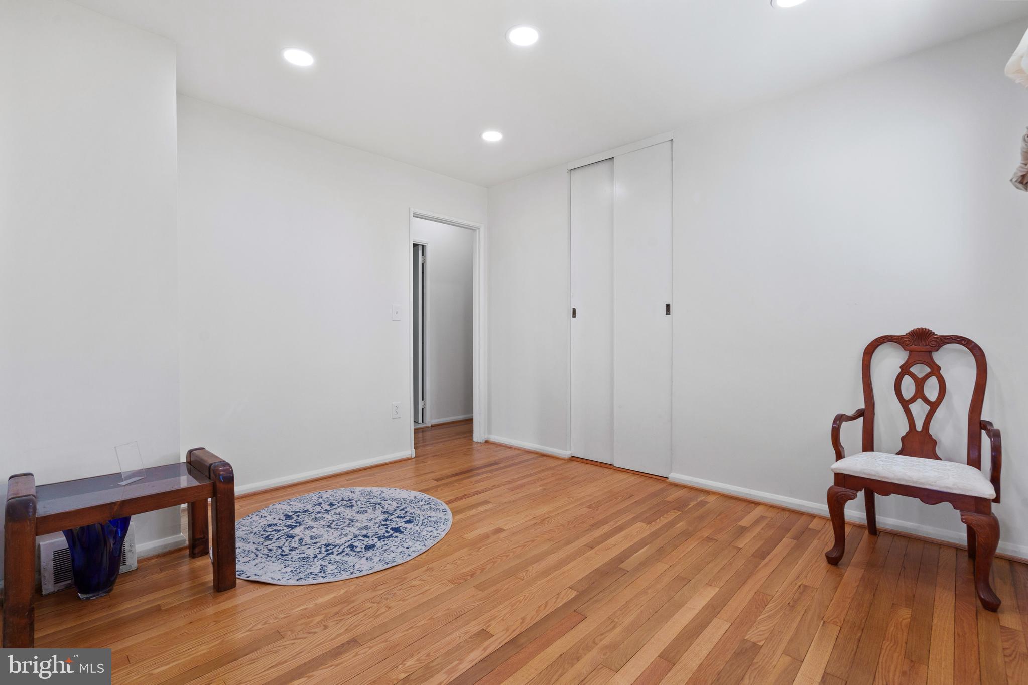 10204 Rodgers Road Fairfax, VA 22030 - Photo 10 of 29 a view of room with furniture and wooden floor
