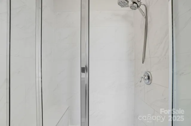 a bedroom with a bed and a table