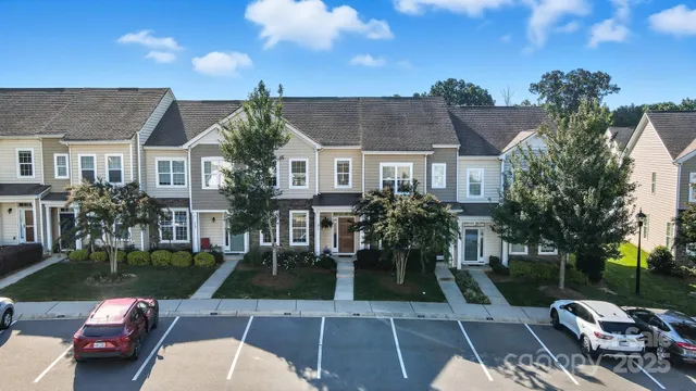 an aerial view of a residential houses and city street
