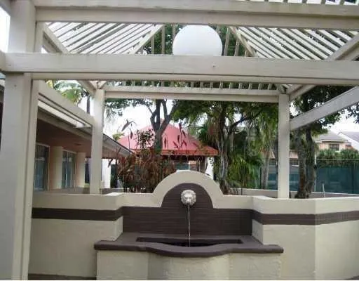 a view of a swimming pool with a backyard