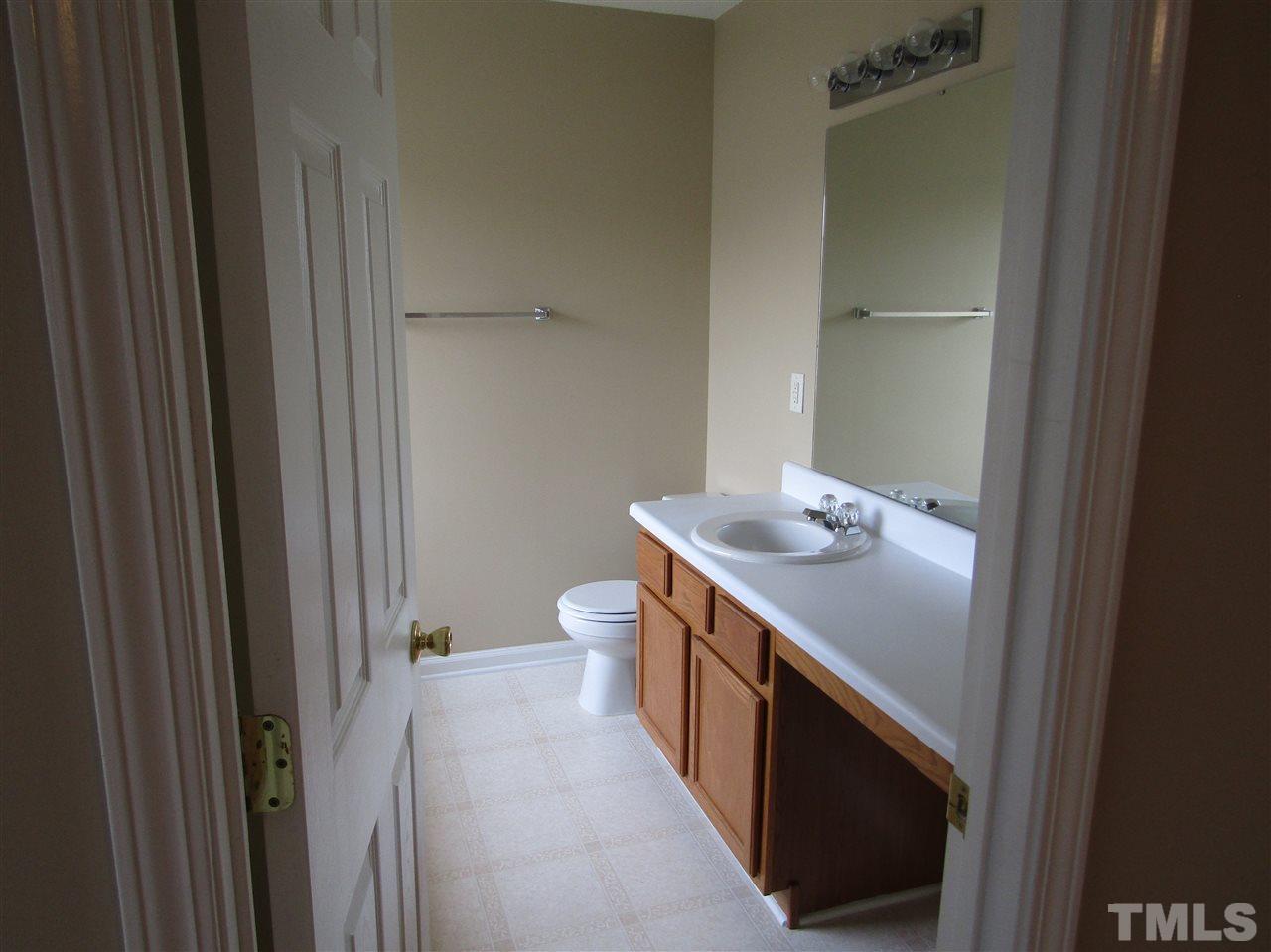 7420 Lowell Ridge Road Raleigh, NC 27616 - Photo 16 of 21 a bathroom with a sink a toilet and shower