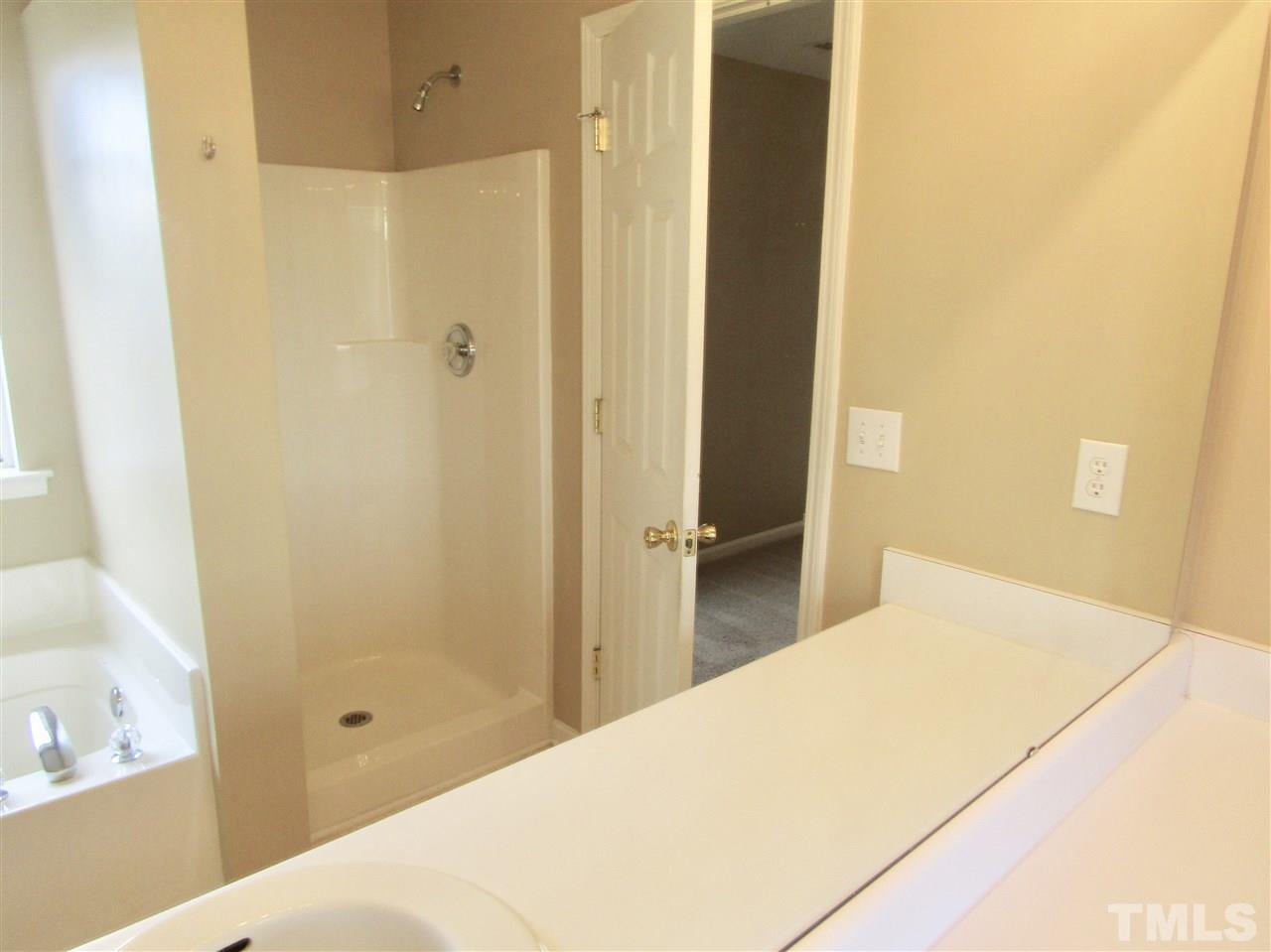 7420 Lowell Ridge Road Raleigh, NC 27616 - Photo 17 of 21 a bathroom with a bathtub and shower