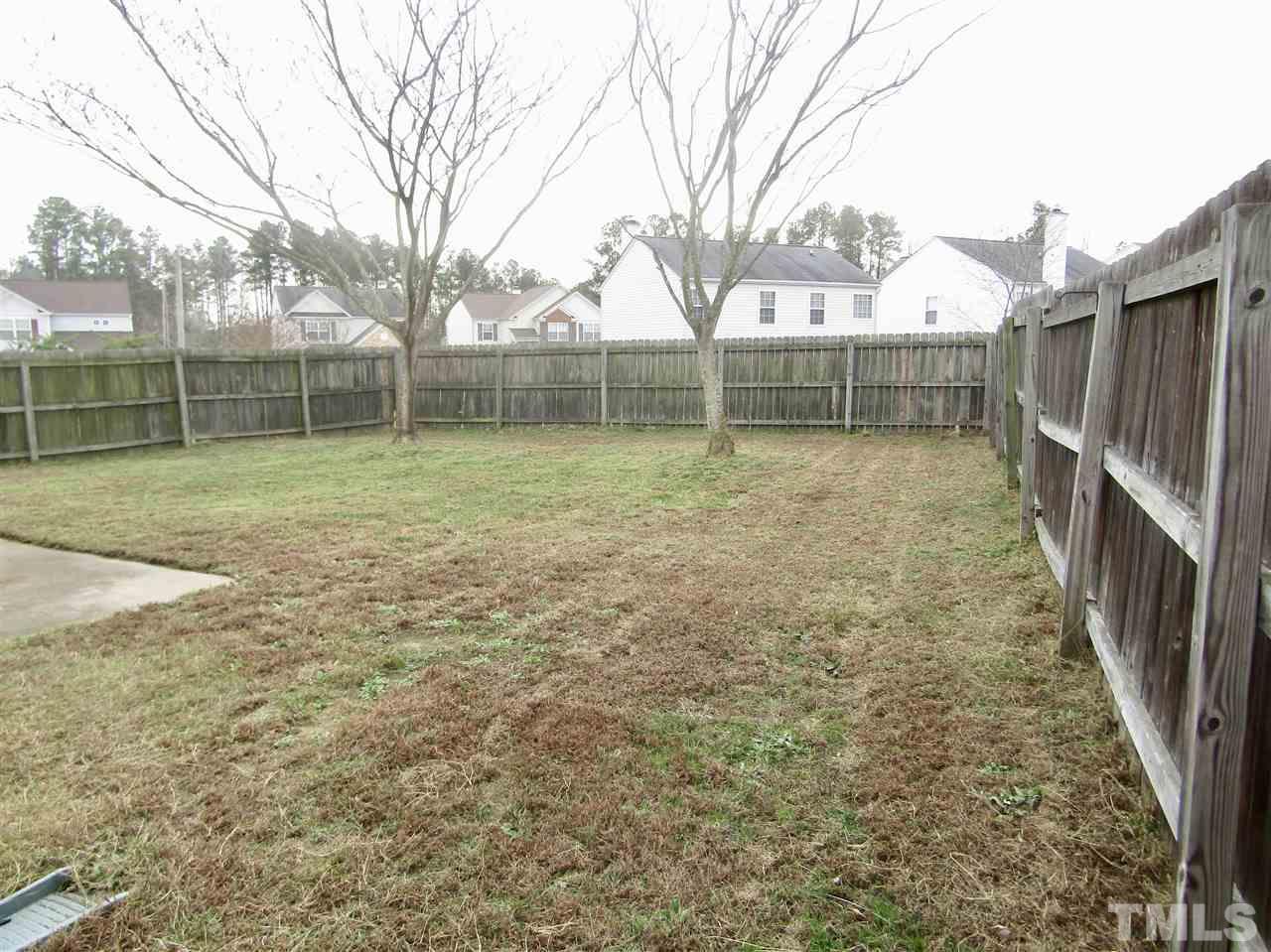 7420 Lowell Ridge Road Raleigh, NC 27616 - Photo 20 of 21 a view of backyard with wooden fence