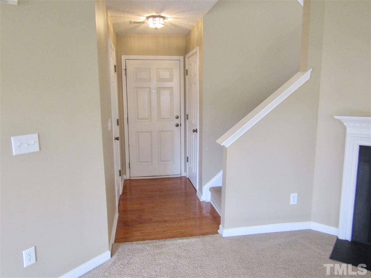 7420 Lowell Ridge Road Raleigh, NC 27616 - Photo 3 of 21 a view of an empty room with entrance and door