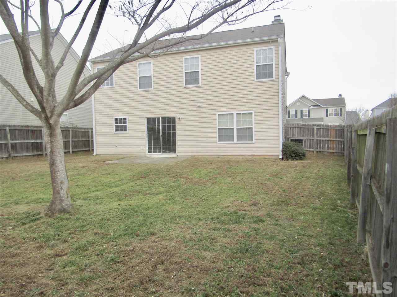7420 Lowell Ridge Road Raleigh, NC 27616 - Photo 21 of 21 a front view of a house with a yard
