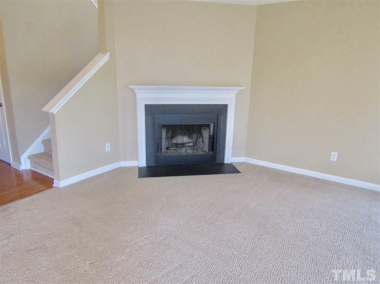 7420 Lowell Ridge Road Raleigh, NC 27616 - Photo 4 of 21 a view of an empty room with a fireplace