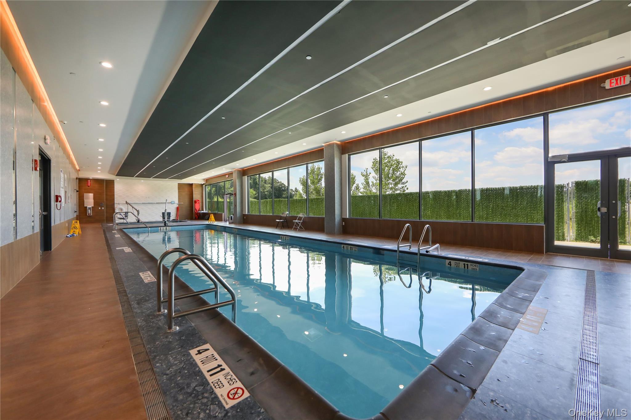 701 Ridge Hill Boulevard, Unit PHE Yonkers, NY 10710 - Photo 10 of 11 Indoor pool featuring french doors